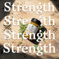 Supplement jar with herbs on a wooden surface, text overlay 'Strength'.