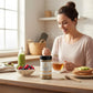 Woman in a kitchen with a bottle of Nature's Plus Chlorella Support on a table.