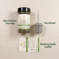 A jar of Nutrey Slim & Detox Tea 150g shown on a light wood background alongside a stainless steel tea infuser and a brewing guide leaflet. Text labels identify the items.